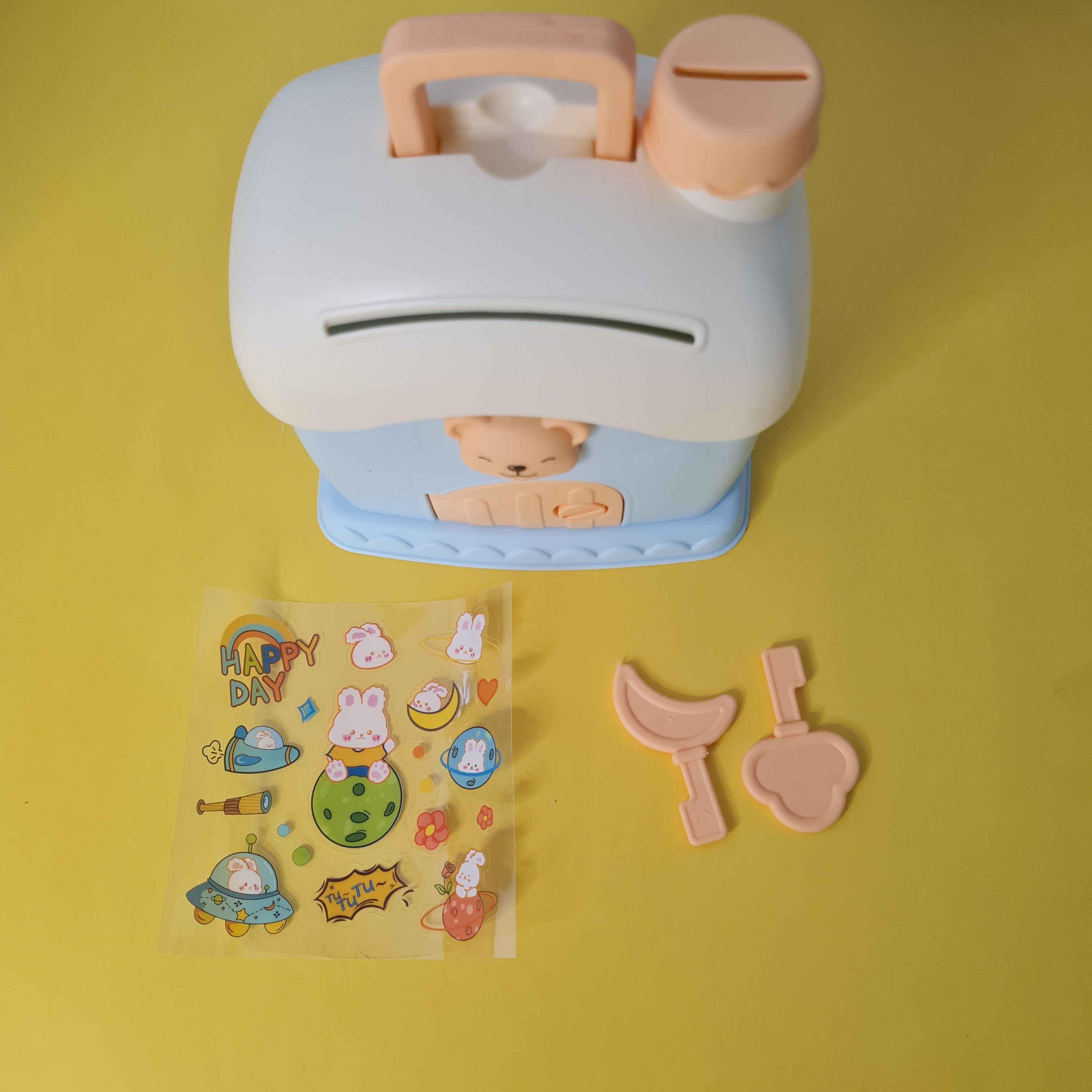 Children's toy with a piggy bank design on a yellow background